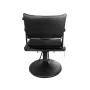 Hairdressing chair made of black imitation leather in a stylish design