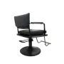 Hairdressing chair made of black imitation leather in a stylish design